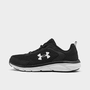 Under Armour Boys&apos; Big Kids&apos; Assert 9 Stay-Put Running Shoes (Wide Width) in Black/Black Size 6.0 - 5674026