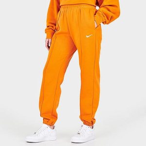 Nike Women&apos;s Sportswear Essential Fleece Jogger Pants in Orange/Light Curry Size XL Cotton/Polyester/Fleece - 5776957