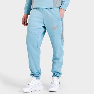 Nike Men&apos;s Sportswear Hybrid Fleece Jogger Pants in Blue/Worn Blue Size Medium Cotton/Polyester/Fleece - 5774339