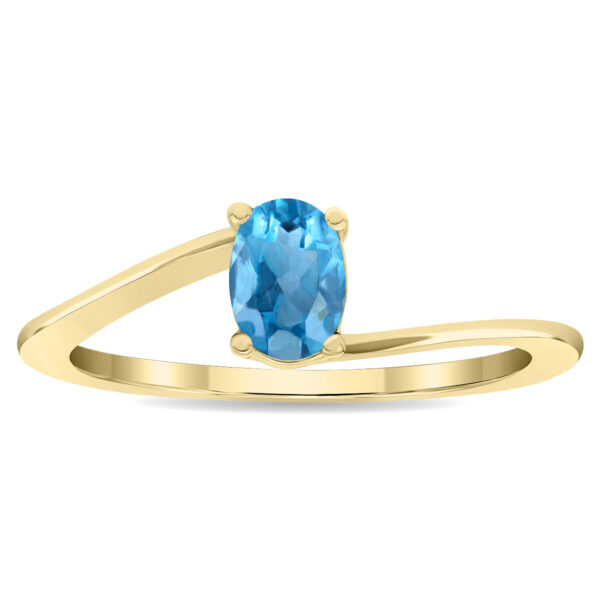 Women's Solitaire Oval Shaped Blue Topaz Wave Ring in 10K Yellow Gold- GRG61129BT